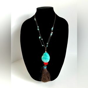 Long Necklace with Large turquoise Stone with Blue Stones on Black Rope.